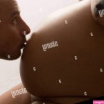 Pregnant naked black woman and white partner Stock Photo