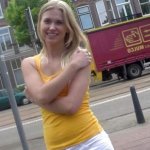 Blonde dutch hottie strips down and masturbates on a couch