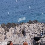 Naked couple sunbathing at beach near Veli Rat Dugi Otok island Dalmatia Croatia Stock Photo