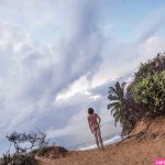Sri Lanka Arugam Bay Rear view of nude man standing on beach stock photo