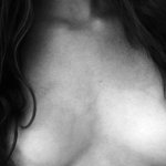 File:Female with naked breasts partially covered with hair.jpg