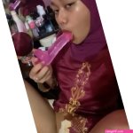 hijabi girl with big long dildo