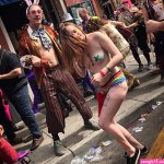 Revellers take selfies and party inside wild Mardi Gras festival in New Orleans